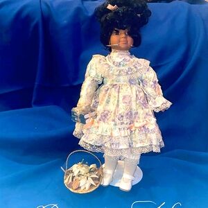 Collectible Porcelain doll with Certificate of Authenticity.